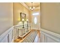Bright and airy entryway with hardwood floors and elegant console table at 202 Palmetto Harbour Dr., North Myrtle Beach, NC 29582