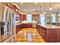 Spacious kitchen featuring stainless steel appliances and rich wood cabinetry at 202 Palmetto Harbour Dr., North Myrtle Beach, NC 29582