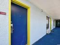 Hotel hallway with blue doors and blue carpet at 6804 N Ocean Blvd. # 1409, Myrtle Beach, SC 29572