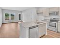Modern kitchen with stainless steel appliances and granite countertops at 265 Sandridgebury Dr. # 62, Little River, SC 29566