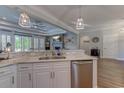 Modern kitchen with white cabinets, stainless steel appliances, and marble countertops at 2500 Suzanne Dr., Conway, SC 29526