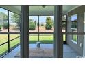 Relaxing screened porch overlooking a lush green backyard at 6548 Torino Lane, Myrtle Beach, SC 29577