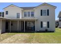 Two-story house with covered porch and small yard at 2202 S Ocean Blvd., North Myrtle Beach, SC 29582