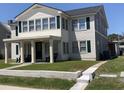 Two-story house with front porch and green lawn at 2202 S Ocean Blvd., North Myrtle Beach, SC 29582