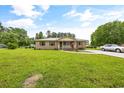 Brick ranch house with a large yard and driveway at 129 Meadowview Rd., Marion, SC 29571