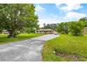 Brick ranch house with a large yard and driveway at 129 Meadowview Rd., Marion, SC 29571