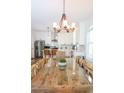 Bright kitchen with white cabinets, farmhouse table, stainless steel appliances at 104 Tidal Creek Dr., Murrells Inlet, SC 29576