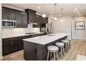 Open kitchen with large island and dark cabinets at 792 Indigo Bay Circle, Myrtle Beach, SC 29579