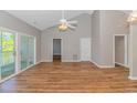 Spacious living room with hardwood floors and access to a balcony at 100 Scotch Broom Dr. # 204, Little River, SC 29566