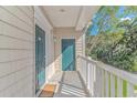 Private balcony with green door and white railing at 100 Scotch Broom Dr. # 204, Little River, SC 29566