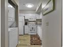 Small kitchen with white cabinets and appliances at 4601 Greenbriar Dr. # 206A, Little River, SC 29566