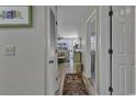 Hallway with access to living room and bedrooms at 4601 Greenbriar Dr. # 206A, Little River, SC 29566