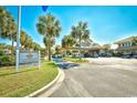 Ocean Lakes community entrance with palm trees and signage at 6001 South Kings Hwy., Myrtle Beach, SC 29575