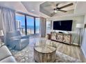 Ocean-view living room with comfy seating at 8560 Queensway Blvd. # 1203, Myrtle Beach, SC 29572