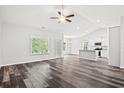 Open-concept living room with kitchen and island at 137 Six Mile Creek Dr., Georgetown, SC 29440