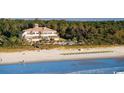 Aerial view of beachfront property with resort-style amenities at 6609 Torino Lane, Myrtle Beach, SC 29572