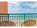 Balcony view with oceanfront seating, showcasing a stunning beach vista at 2207 S Ocean Blvd. # 1401, Myrtle Beach, SC 29577