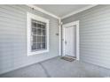 Exterior view of a condo building with white door and window at 4874 Luster Leaf Circle # 304, Myrtle Beach, SC 29577