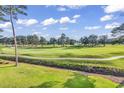 Green golf course with walking path and lush landscape at 4874 Luster Leaf Circle # 304, Myrtle Beach, SC 29577