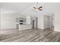 Modern kitchen with gray cabinets and granite countertops at 300 Lakota Loop, Longs, SC 29568