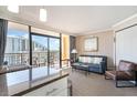Living room with balcony access and ocean view at 6900 N Ocean Blvd. # 910, Myrtle Beach, SC 29572