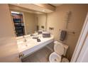 Bathroom with single sink vanity, toilet, and mirror at 1501 S Ocean Blvd. # 1540, Myrtle Beach, SC 29577