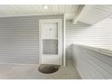 Condo building exterior entryway with storm door at 8725 Chandler Dr. # F, Surfside Beach, SC 29575