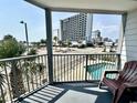 Balcony overlooking pool, street, and ocean at 1906 S Ocean Blvd. # 2-108-A, Myrtle Beach, SC 29577