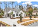 White two-story home with gray roof, landscaping, and driveway at 2084 Timmerman Rd., Myrtle Beach, SC 29588