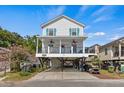 Two-story home with deck, golf cart, and parking at 6001 - 1389 S Kings Hwy., Myrtle Beach, SC 29575