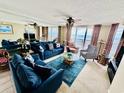Spacious living room with ocean view, comfy seating, and stylish decor at 1401 S Ocean Blvd. # 1001, North Myrtle Beach, SC 29582