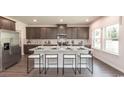 Modern kitchen with island, granite countertops, stainless steel appliances at 7089 Watercress St, Myrtle Beach, SC 29579