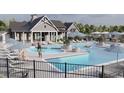 Community pool with lounge chairs and umbrellas at 614 Castle Ct., Myrtle Beach, SC 29579
