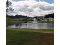 Community pond with fountain and surrounding homes at 173 Rocko Dr., Myrtle Beach, SC 29579