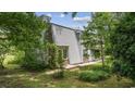 View of home's side with mature landscaping at 4860 Elm Rd., Murrells Inlet, SC 29576