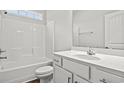 Clean bathroom with white vanity, tub, and toilet at 3409 Little Bay Dr., Conway, SC 29526