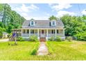 This charming house features a wraparound porch and a spacious yard at 406 N Nichols St., Nichols, SC 29581