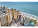 Aerial view of beachfront condo building, showcasing oceanfront location and surrounding buildings at 501 S Ocean Blvd. # 308, North Myrtle Beach, SC 29582