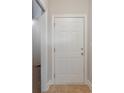 Simple entryway with a white door and tile flooring at 4935 Crab Pond Ct. # 202, Myrtle Beach, SC 29579