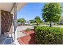 Landscaped front yard with manicured hedges and shrubs at 647 Riverward Dr. # 647, Myrtle Beach, SC 29588