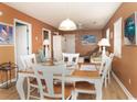 Bright dining area with a table and chairs, adjacent to the living room at 1505 Hillside Dr. # 2, North Myrtle Beach, SC 29582