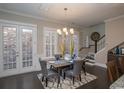 Elegant dining room featuring a rustic table and gray chairs, with access to backyard at 852 Iris St. # C, Myrtle Beach, SC 29577