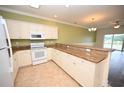 Bright kitchen, granite countertops, white appliances at 110 South Shore Blvd. # 202, Longs, SC 29568