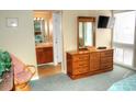 Bedroom with dresser, TV, and access to bathroom at 351 Lake Arrowhead Rd. # 4-315, Myrtle Beach, SC 29572