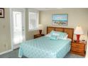 Bedroom with a queen bed and access to a patio at 351 Lake Arrowhead Rd. # 4-315, Myrtle Beach, SC 29572