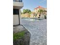 Community pool with brick pavers and surrounding patio furniture at 7509 N Ocean Blvd., Myrtle Beach, SC 29572