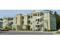 Green apartment building with multiple units and parking at 35 Delray Dr. # 2-C, Murrells Inlet, SC 29576