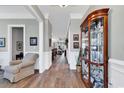 Bright and spacious entryway with hardwood floors, displaying a curio cabinet at 1312 Ashboro Ct., Myrtle Beach, SC 29579