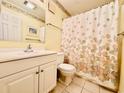 Small bathroom with shower/tub combo and seashell decor at 207 N Ocean Blvd. # 242, North Myrtle Beach, SC 29582