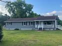 Ranch style home with gray siding, white trim, and a covered porch at 3486 Bethel Chapel Rd., Loris, SC 29569